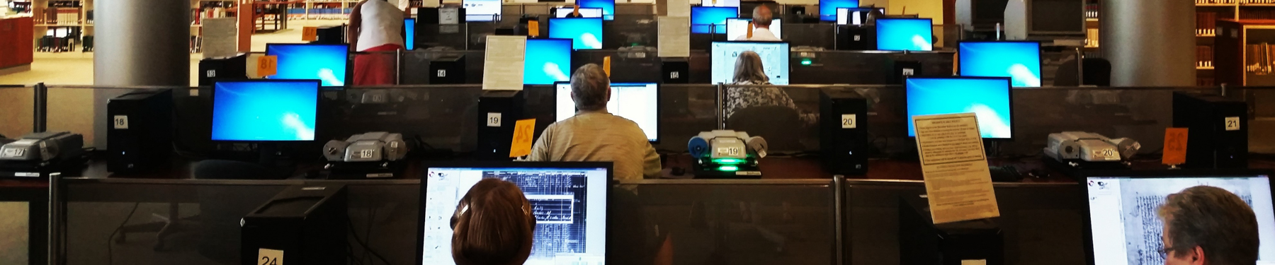 Researchers viewing microfilm.