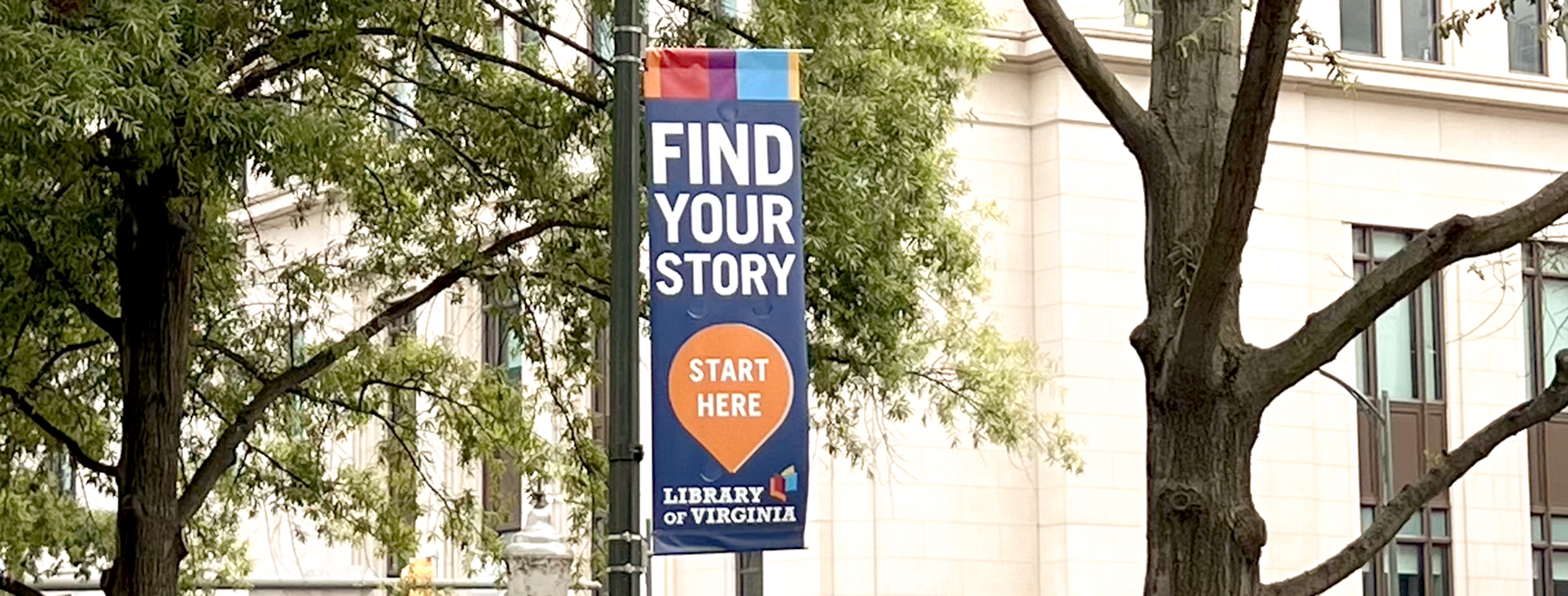 Banner outside the library that says Find Your Story, Start Here